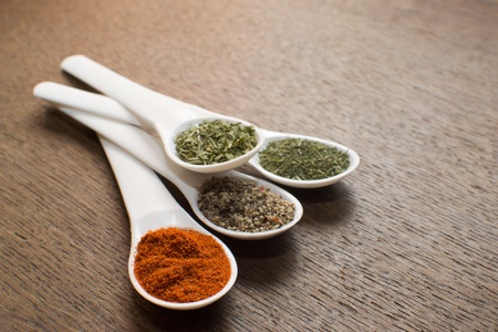 Colorful spices on the old table の写真素材