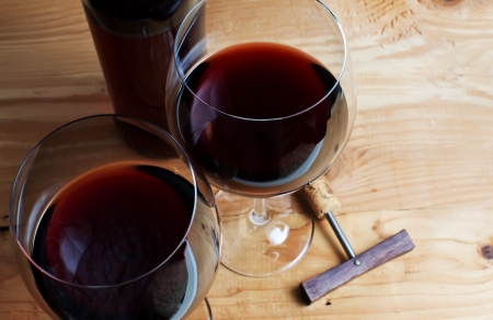 Wine glass and Bottle on a wooden background の写真素材