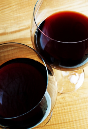 Wine glasses on a wooden background の写真素材