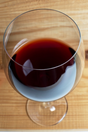 Wine glass on a wooden background の写真素材
