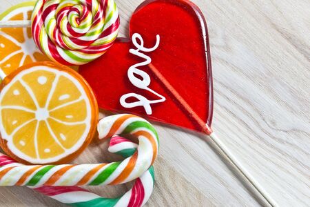 colorful lollipop on wooden backgroundの写真素材