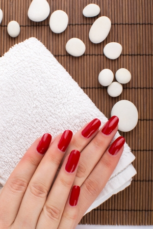 Beautiful hand with perfect nail red manicureの写真素材