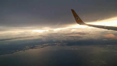 Nok air in the sky and above Thai gulf in the evening time の素材