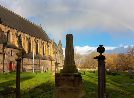 A rainbow over Govan Old Parish Church, Glasgow, Scotlandの写真素材