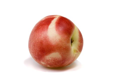 Sweet and ripe nectarine on white ground