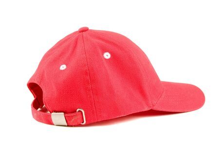 Red baseball hat on white groundの写真素材