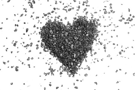 Black heart made with stonesの写真素材