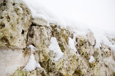 Stones covered with snowの写真素材