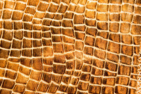 Golden leather texture as a backgroundの写真素材