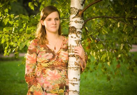 Pregnant young woman holding birchの写真素材