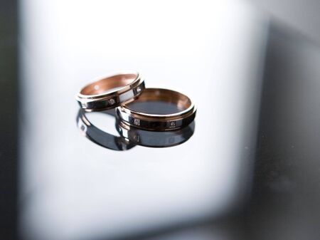 Two wedding rings in beamの写真素材