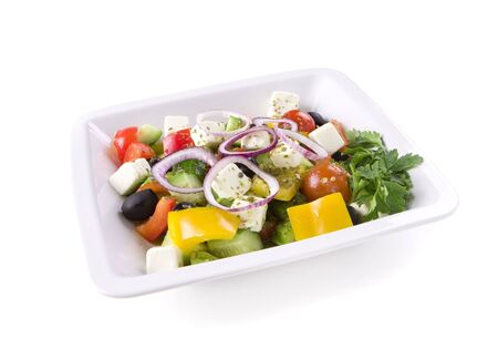 Bowl of Greek Salad on white groundの写真素材