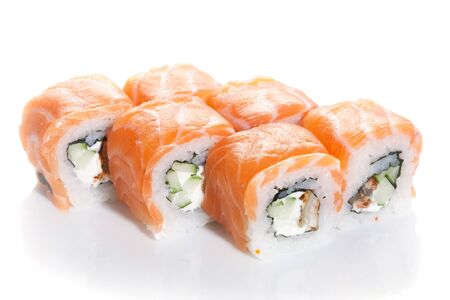 Sushi maki with salmon topping on white groundの写真素材