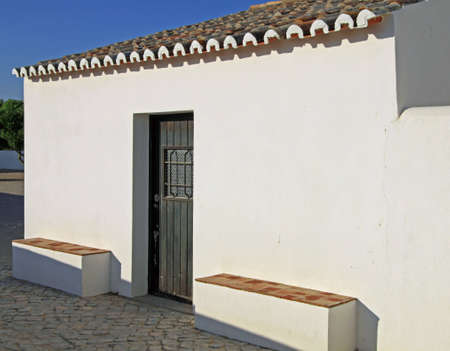 Ancient typical house in Algarve, Portugal, at the end of the afternoonの写真素材