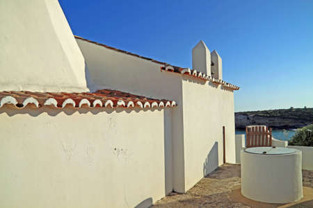 Old coastal church in Algarve, Portugalの写真素材