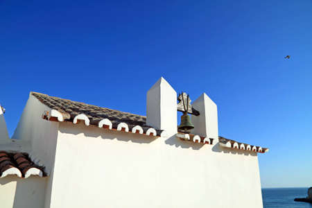 Old coastal church in Algarve, Portugalの写真素材