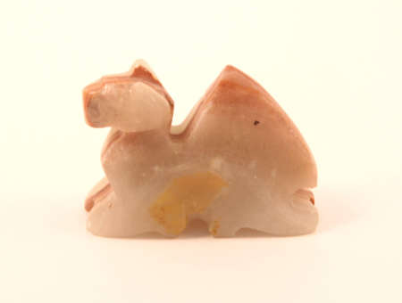 Handcraft Souvenir depicting a camel, isolated on whiteの写真素材