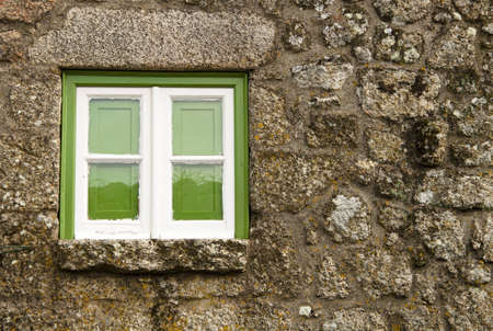 Green window of an old house, in Monsanto, Portugalの写真素材