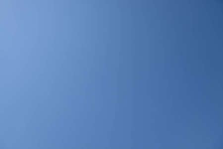 Clear blue sky with the sun light coming from the upper leftの写真素材