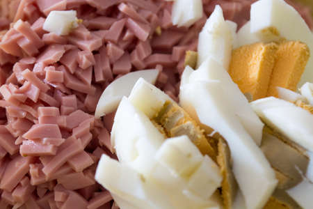 Closeup of ingredients for russian salad. Salami and eggsの写真素材