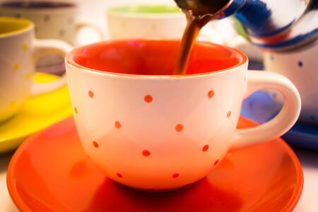 Coffee cups aranged, and ready to be filled with coffeeの写真素材