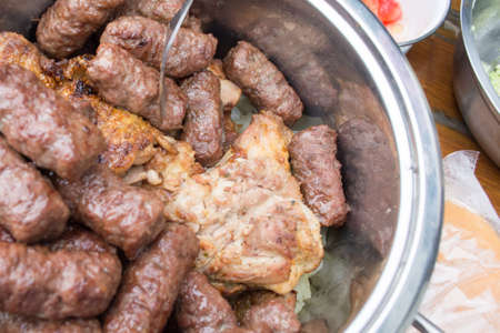 Bowl full with grilled meat. Pork chops, cevapciciの写真素材
