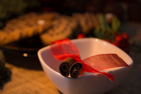 Atmospheric shoot of christmas eve with cookies and candlesの写真素材