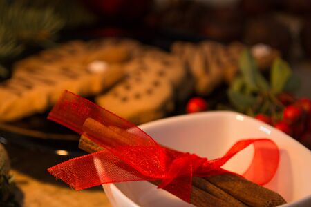 Atmospheric shoot of christmas eve with cookies and candlesの写真素材