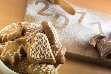 Decorated gingerbread cookies in white bowlの写真素材