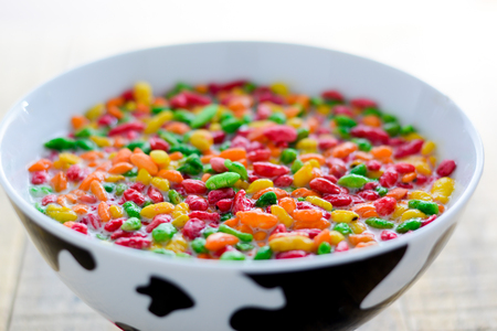 Prepared breakfast with milk and colorful puffed riceの写真素材