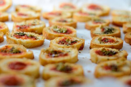 Fresh baked light and delicious bruschetta appetizers with tomato amd oregano. Selective focus