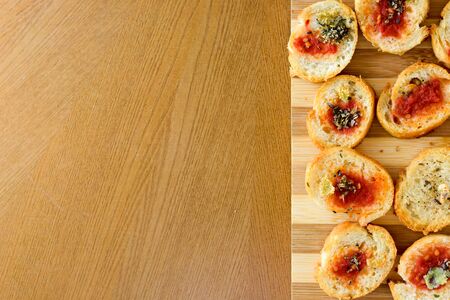 Light and delicious bruschetta appetizers with tomato amd oregano with copyspace