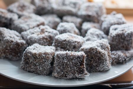 Close up of chocolate cakes with coconut flour on the ceramic plateの写真素材