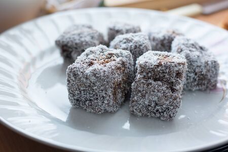 Close up of chocolate cakes with coconut flour on the ceramic plateの写真素材