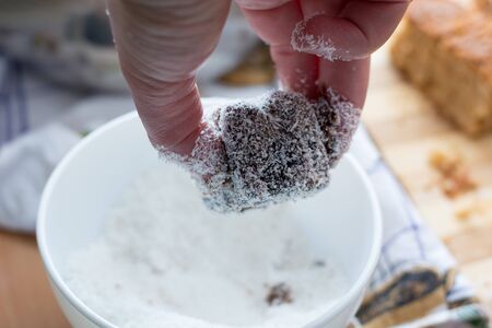 Female hands making brownies with coconut flour and chocolateの写真素材