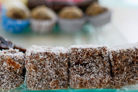 Colorful and delicious brownies with coconut flour cakes arranged on glass plate for celebration of the Saint dayの写真素材