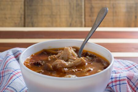 Traditional and very popular serbian dish from beef tripe served on wooden table