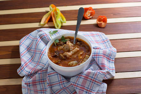 Traditional and very popular serbian dish from beef tripe served on wooden tableの写真素材