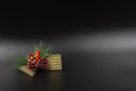 Horizontal composition for a holiday card for wishes or any text with a black background, on the right side a santa claus on a sledge, on the left side a Christmas ornamentの写真素材