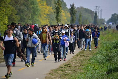 October 6,2015; Hegyeshalom in Hungary. Group of refugees leaving Hungary. They came to Hegyeshalom by train and then they leaving Hungary and go to Austria and then to Germany. Many of them escapes from home because of civil war.のeditorial素材