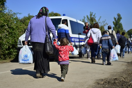 October 4, 2015; Bapska in Serbia. Group of refugees leaving Serbia. They came to Bapska by buses and then they leaving Serbia and go to Croatia and then to Germany. Many of them escapes from home because of civil war.のeditorial素材