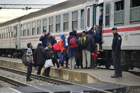 October 5, 2015; Tovarnik in Croatia. Croatian police assist refugees get into train which will go to Hungary.のeditorial素材