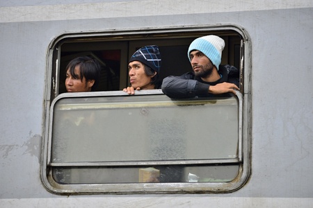 October 5, 2015; Tovarnik in Croatia. Croatian police assist refugees get into train which will go...