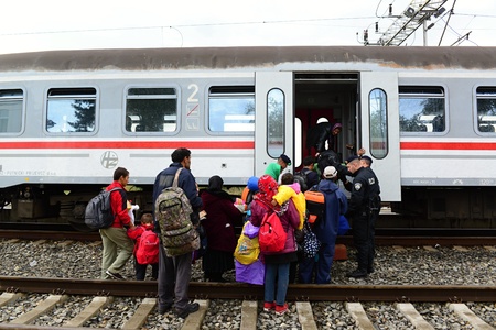 October 6,2015; Hegyeshalom in Hungary. Group of refugees leaving Hungary. They came to Hegyeshalom by train and then they leaving Hungary and go to Austria and then to Germany. Many of them escapes from home because of civil war.のeditorial素材