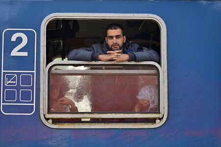 October 6,2015; Hegyeshalom in Hungary. Group of refugees leaving Hungary. They came to Hegyeshalom by train and then they leaving Hungary and go to Austria and then to Germany. Many of them escapes from home because of civil war.のeditorial素材