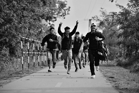 October 6,2015; Hegyeshalom in Hungary. Group of refugees leaving Hungary. They came to Hegyeshalom by train and then they leaving Hungary and go to Austria and then to Germany. Many of them escapes from home because of civil war.のeditorial素材