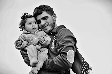 October 6,2015; Hegyeshalom in Hungary. Group of refugees leaving Hungary. They came to Hegyeshalom by train and then they leaving Hungary and go to Austria and then to Germany. Many of them escapes from home because of civil war.のeditorial素材