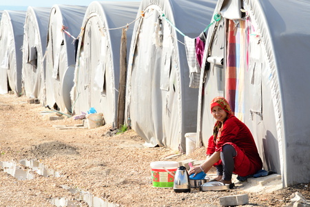 Syrian people in refugee camp in Suruc. These people are refugees from Kobane and escaped because of Islamic state attack. 3.4.2015, Suruc, Turkeyのeditorial素材