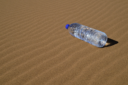 Bottle of water in Saharaの写真素材