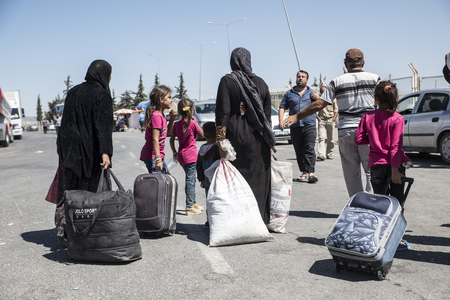 Syrian refugees (mainly from Aleppo and Idlib) entering Turkey in Kilis. Most of them will live in refugee camp. September 8, 2017; Kilis, Turkey.のeditorial素材